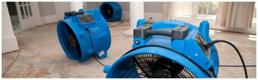 Water damage restoration work in a flooded room